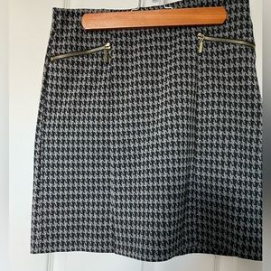 George - black/gray houndstooth pattern skirt.